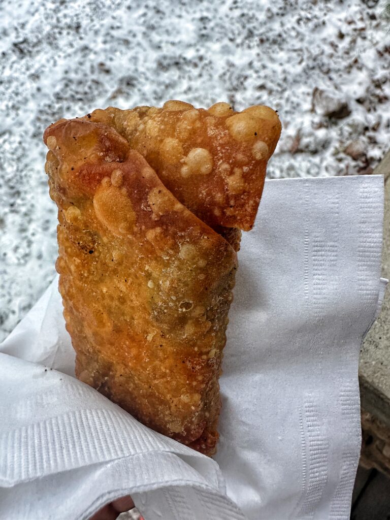 A finished egg roll in a napkin