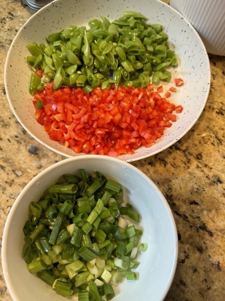 Veggies for the noodles separated into different bowls