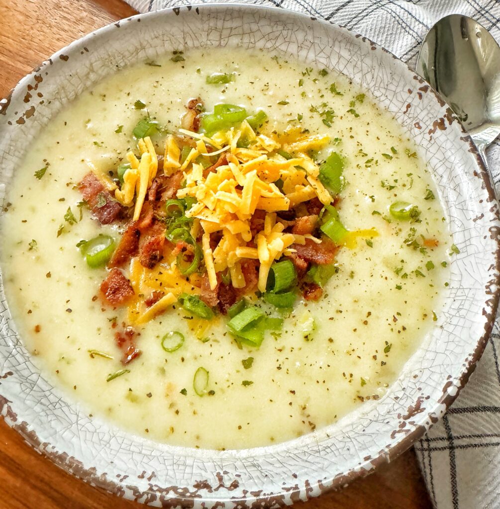 Potato soup topped with bacon and cheese