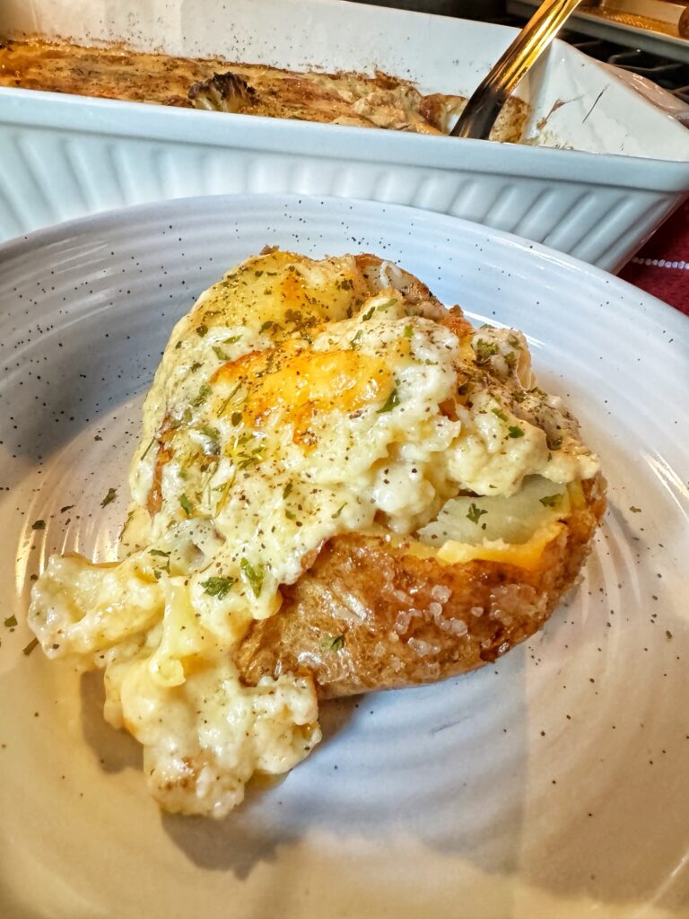 Cheesy Cauliflower over a crispy baked potato
