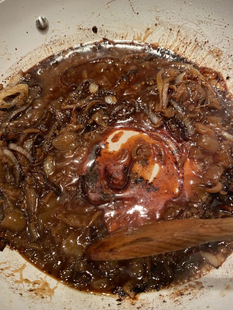 Yellow onions sautéing for French Onion Pork Chops