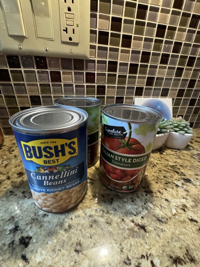 A jar of Bush's cannellini beans and a can of Italian style diced tomatoes