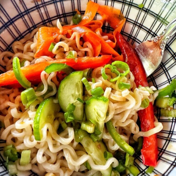 Cold ramen noodle salad in a bowl with a fork.