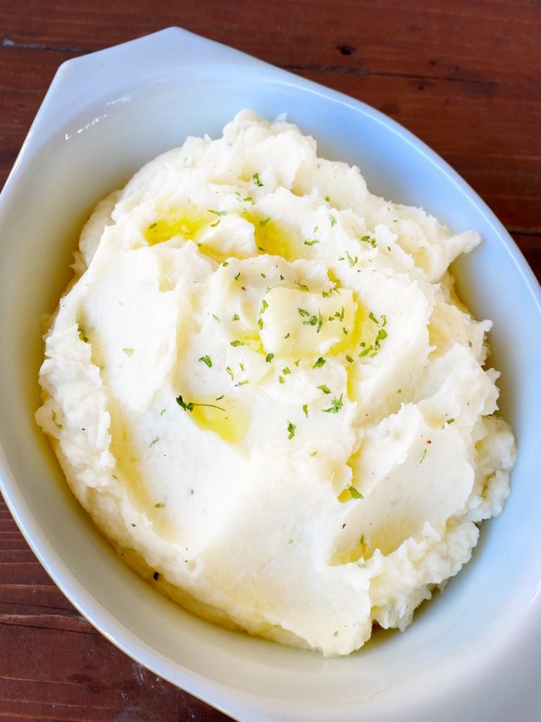 Mashed potatoes in a white baking dish