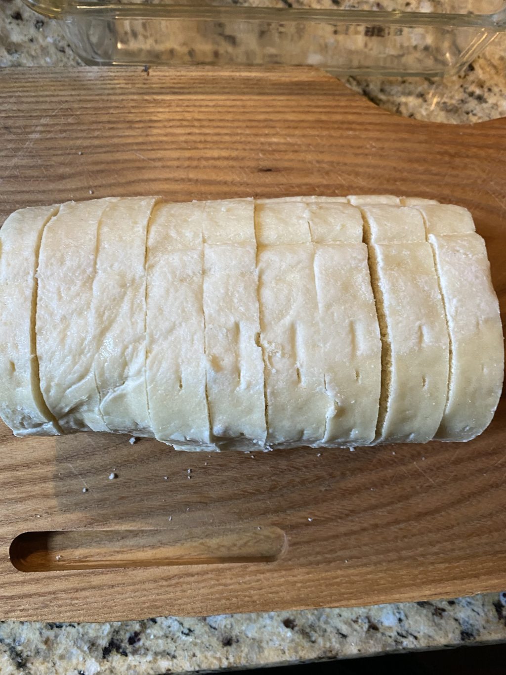 Sliced bread dumplings on a wooden cutting board