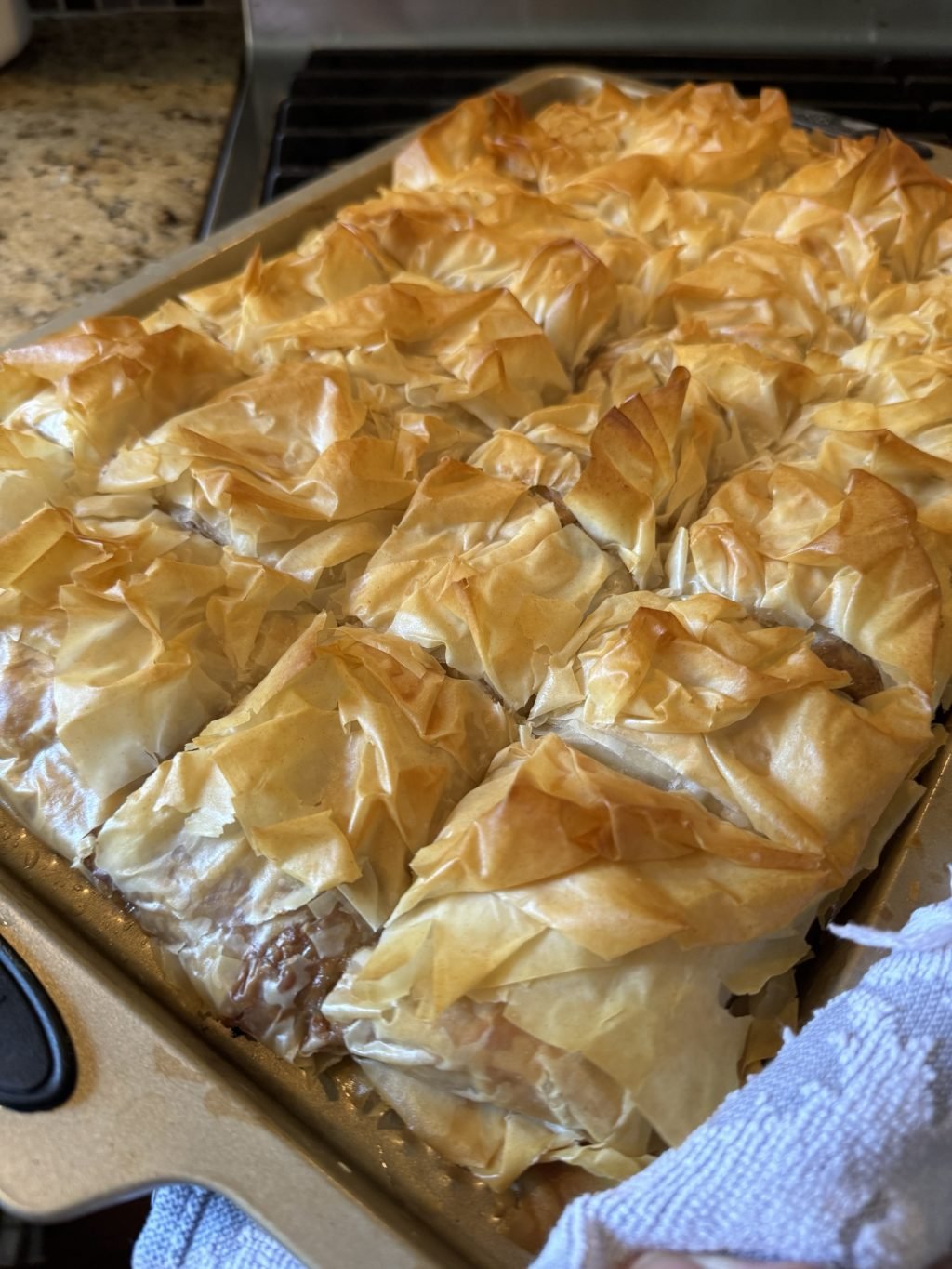 The finished Cheeseburger Spring Roll dish, cut into squares on a baking dish