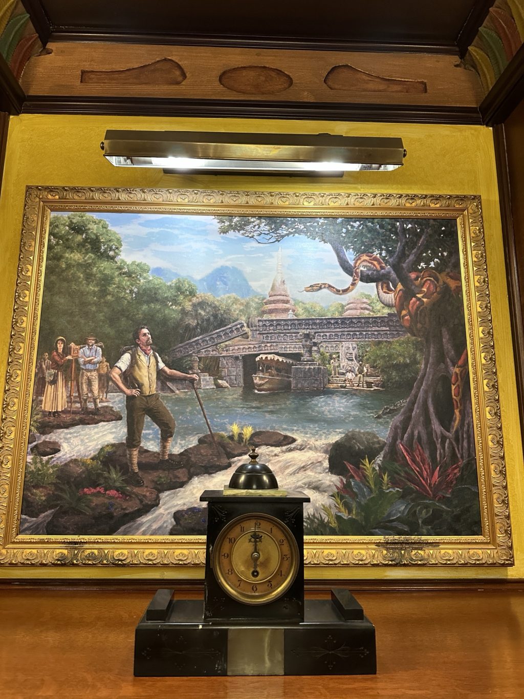 A portrait from inside Skipper Canteen of an adventurer looking at a boat emerging from under a bridge