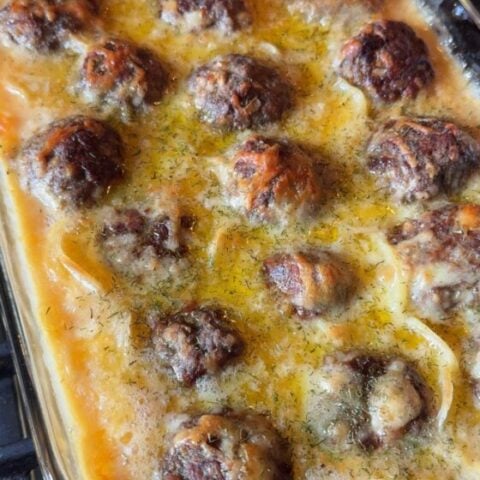 Au Gratin Meatballs in a glass baking dish.