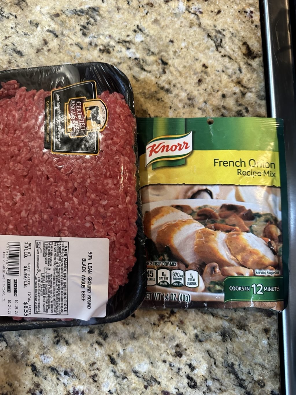 A package of 90% lean ground beef next to a package of Knorr French Onion mix.