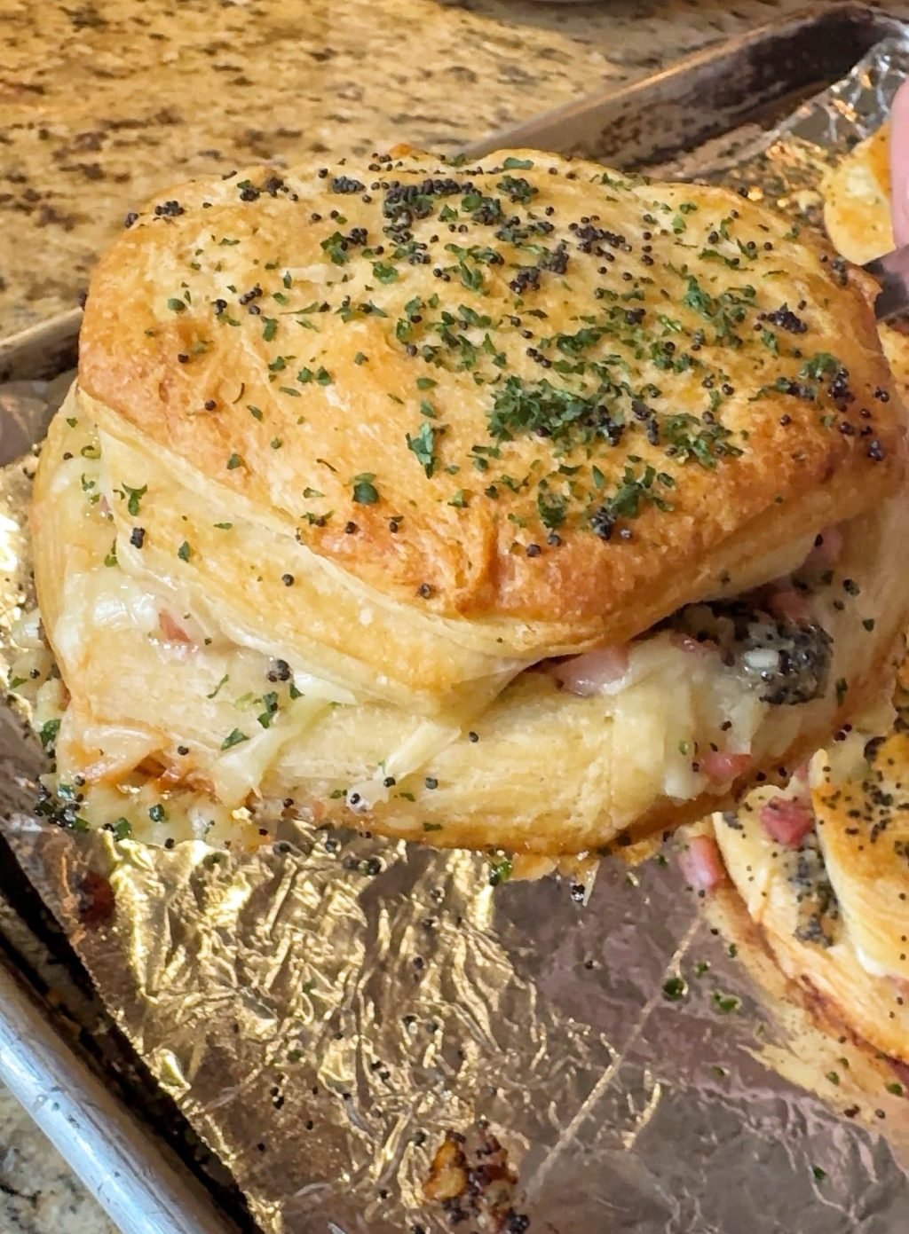 A close up of a finished Ham and Cheese Biscuit