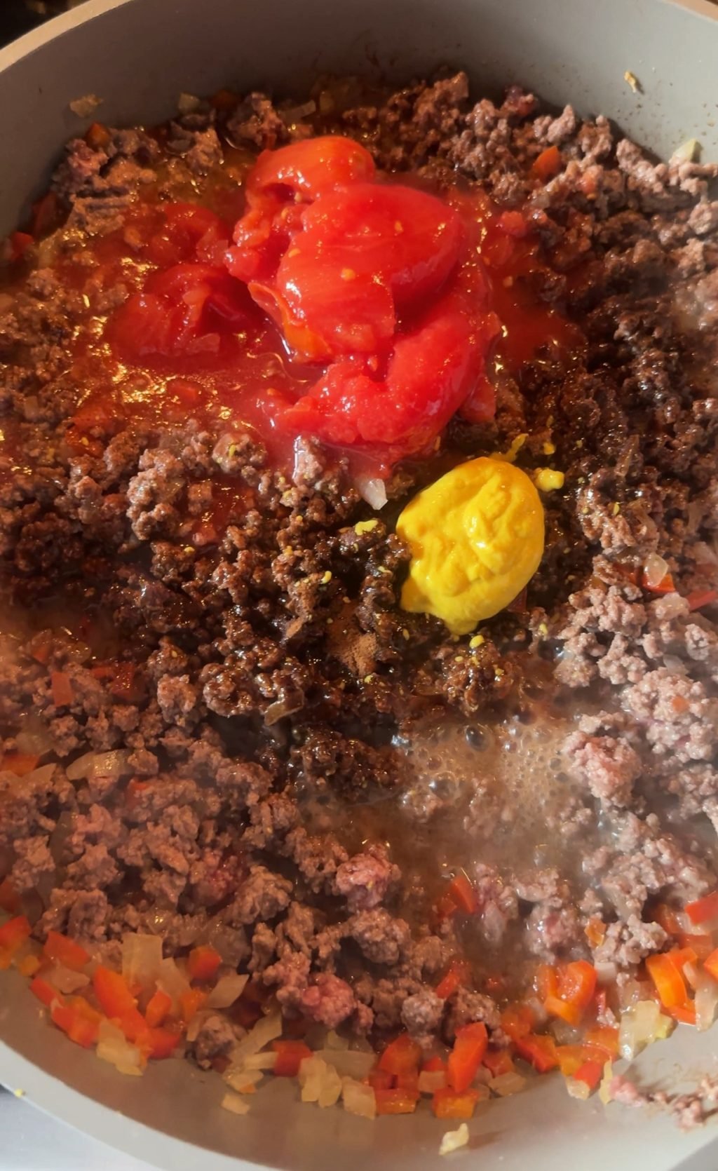 Tomato and mustard on top of the beef and veggie mixture