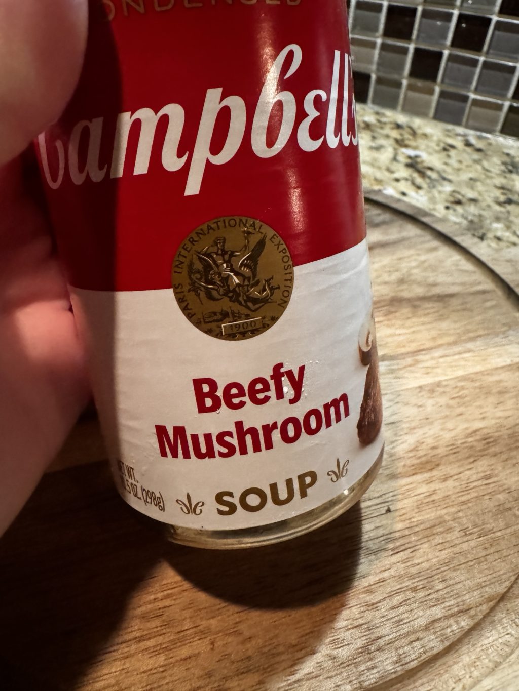 A can of Campbell's Beefy Mushroom Soup.