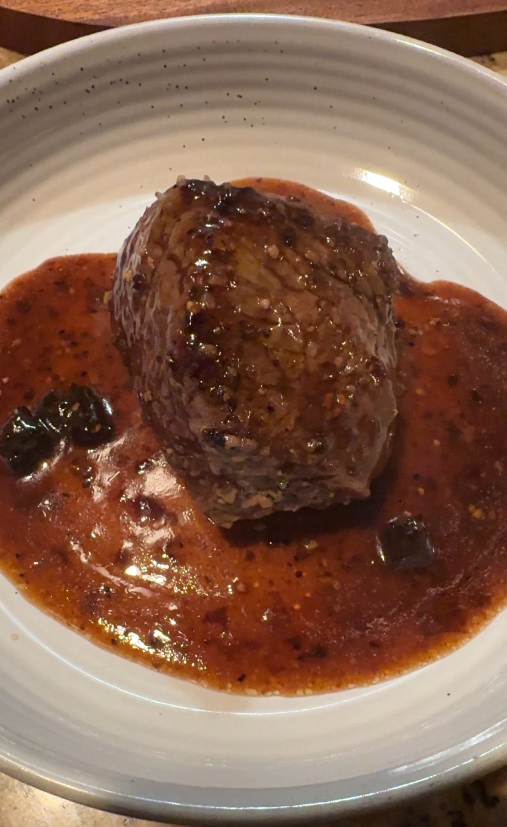 A finished sirloin filet in mushroom gravy.