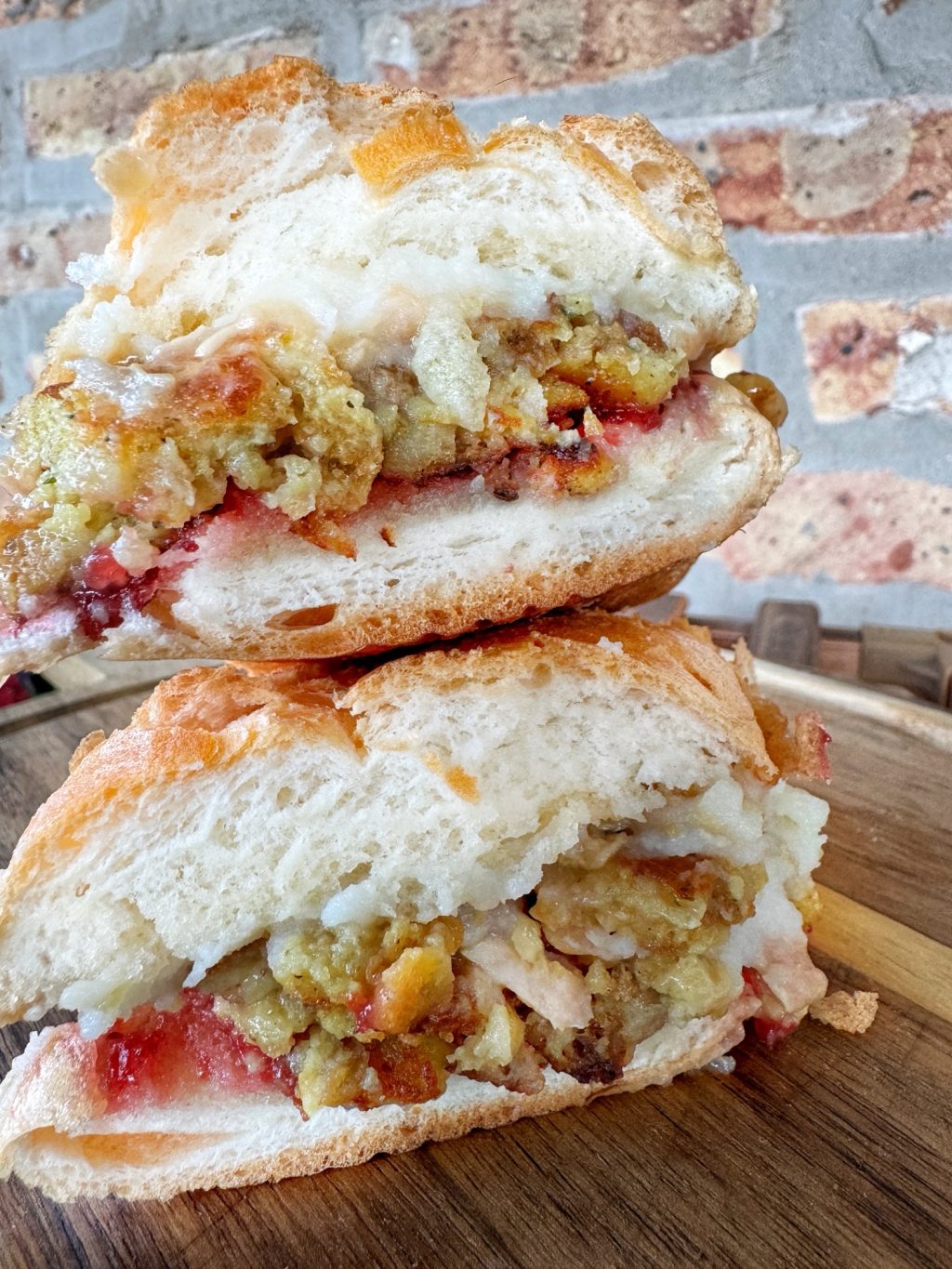 The completed Thanksgiving leftovers sandwich with one half on top of the other.