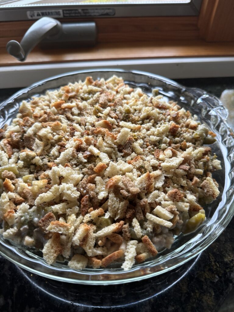 Green bean casserole in a glass bowl.