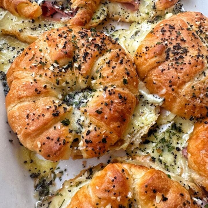 Baked ham and cheese croissants with everything bagel seasoning on top.