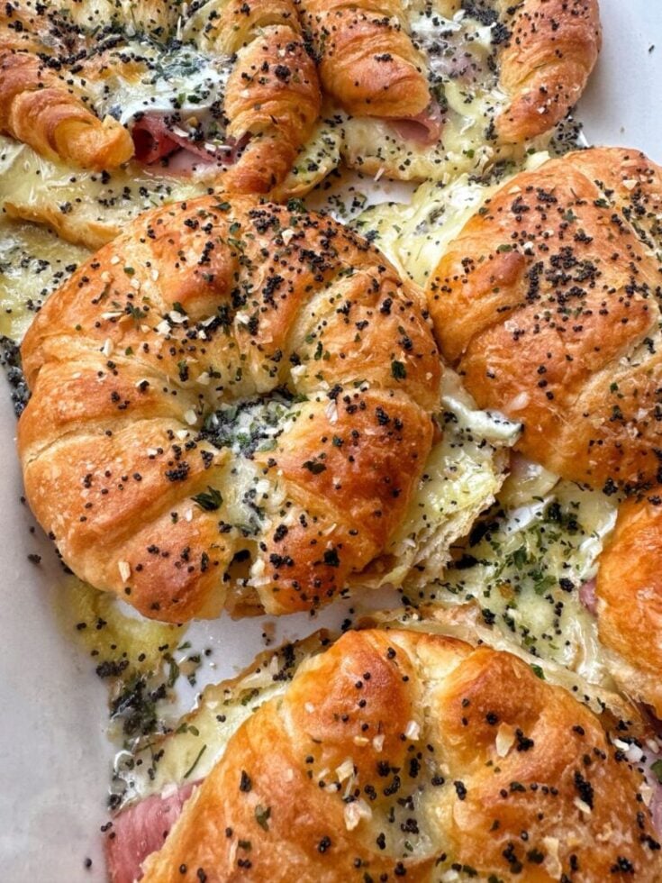 Baked ham and cheese croissants with everything bagel seasoning on top.