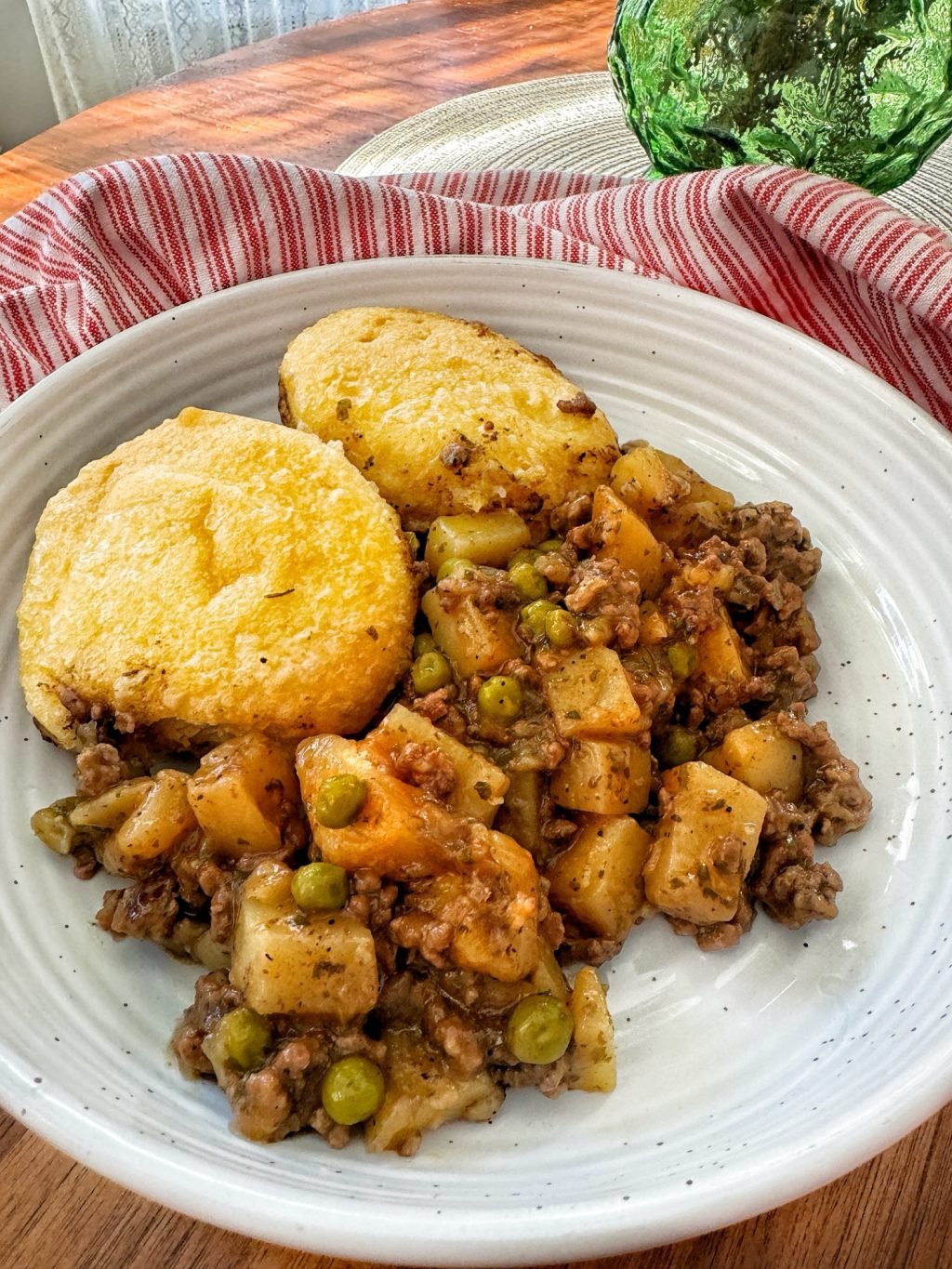 Biscuits and Beef and Potato Stew on a plate