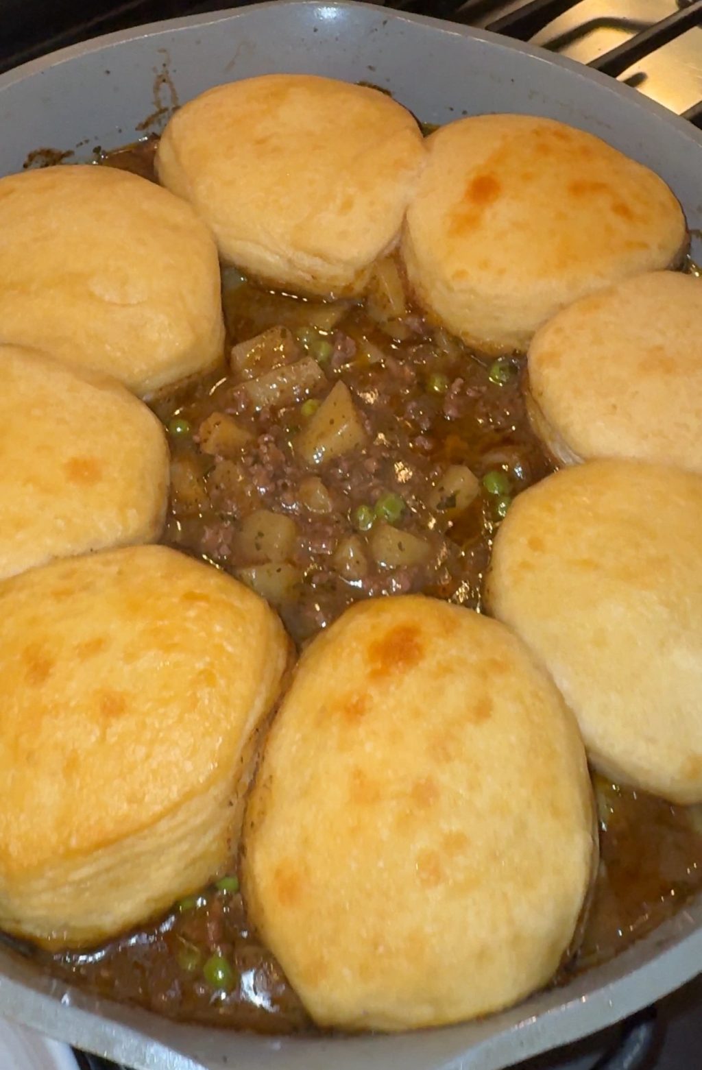 Biscuits in a circle over beef stew