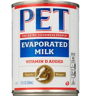 Canned evaporated milk used to make Grandma's Kraft Dinner extra creamy