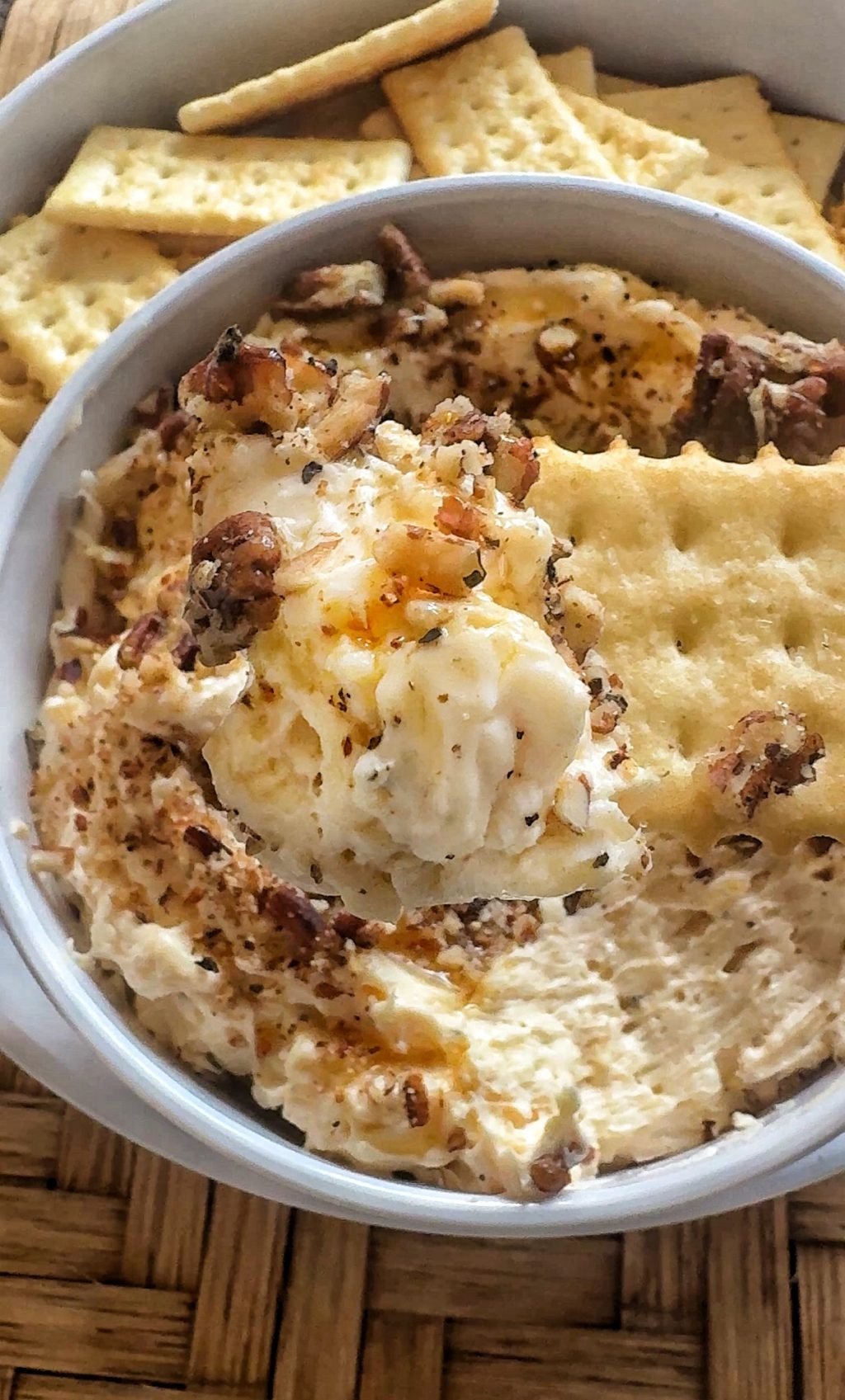 A close up of the dip on a cracker