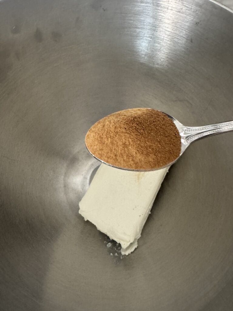 A spoon of Worcestershire powder over cream cheese