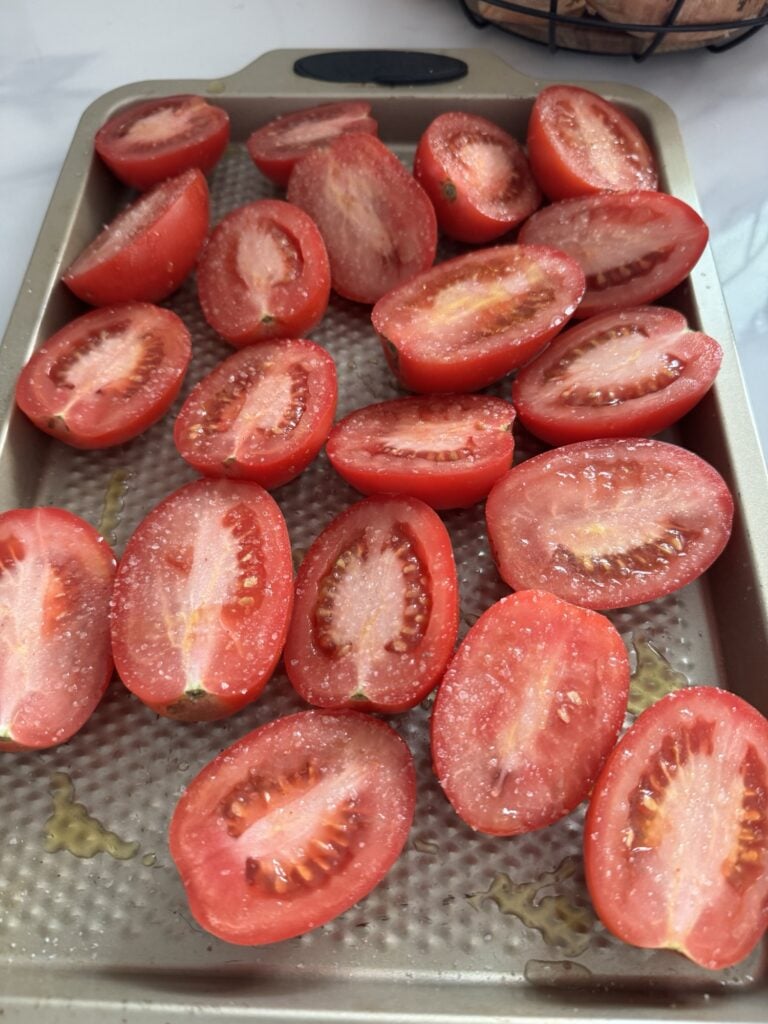 Halved, salted and oiled Roma tomatoes