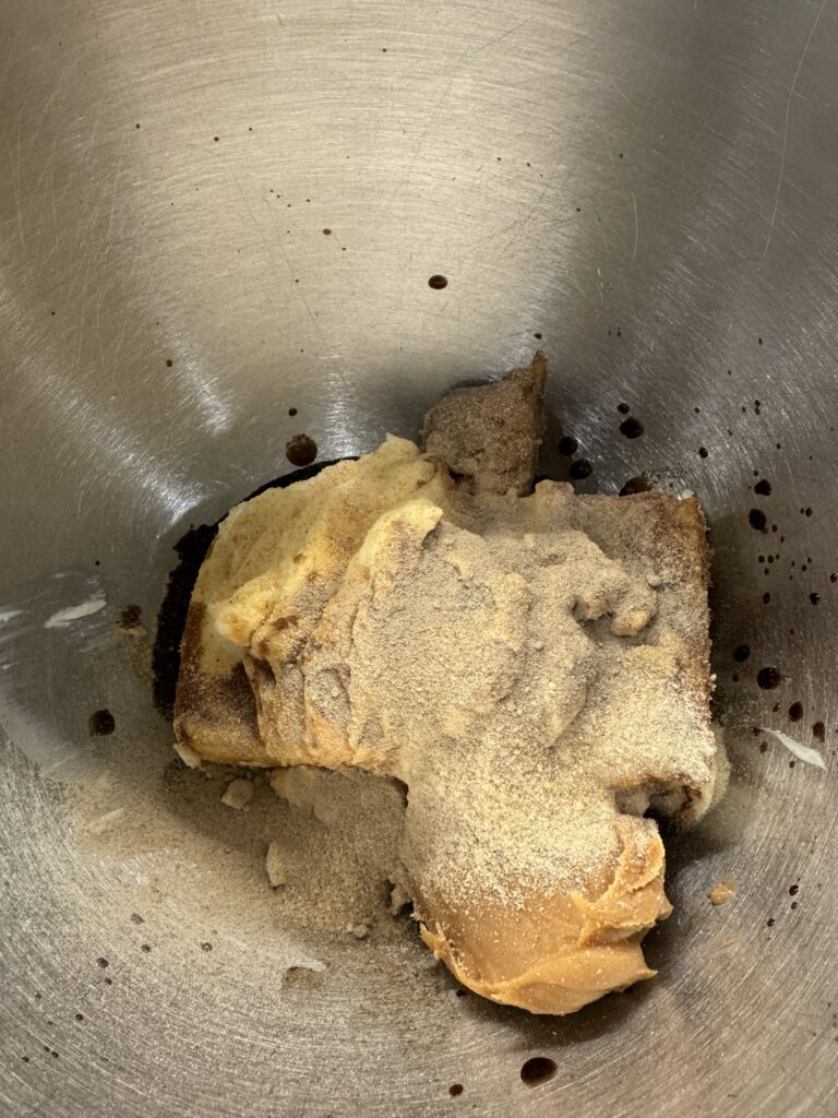 The dip ingredients in a metal mixing bowl