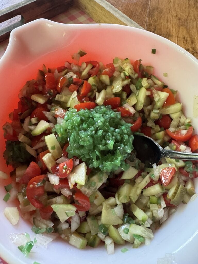 Relish on top of the bowl of hot dog topper