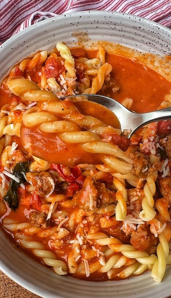 A spoon of the pasta with the sauce