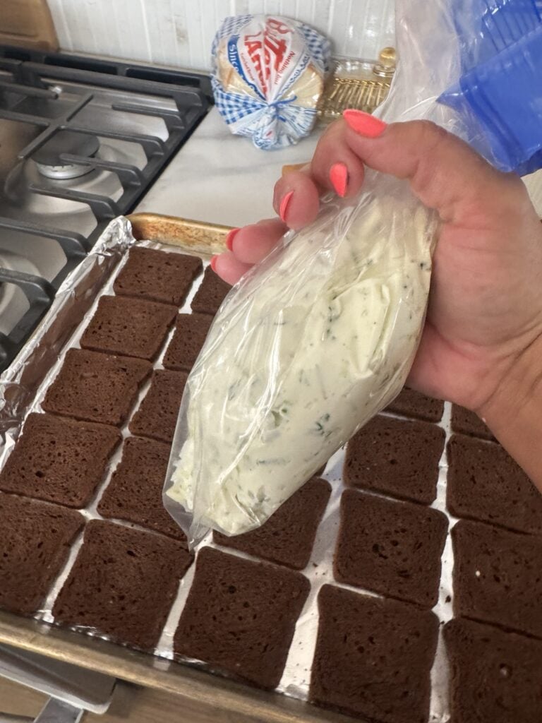 The cream cheese mixture in a piping bag