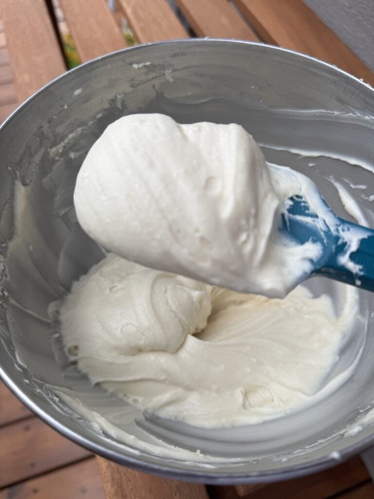 The icing on a blue spatula