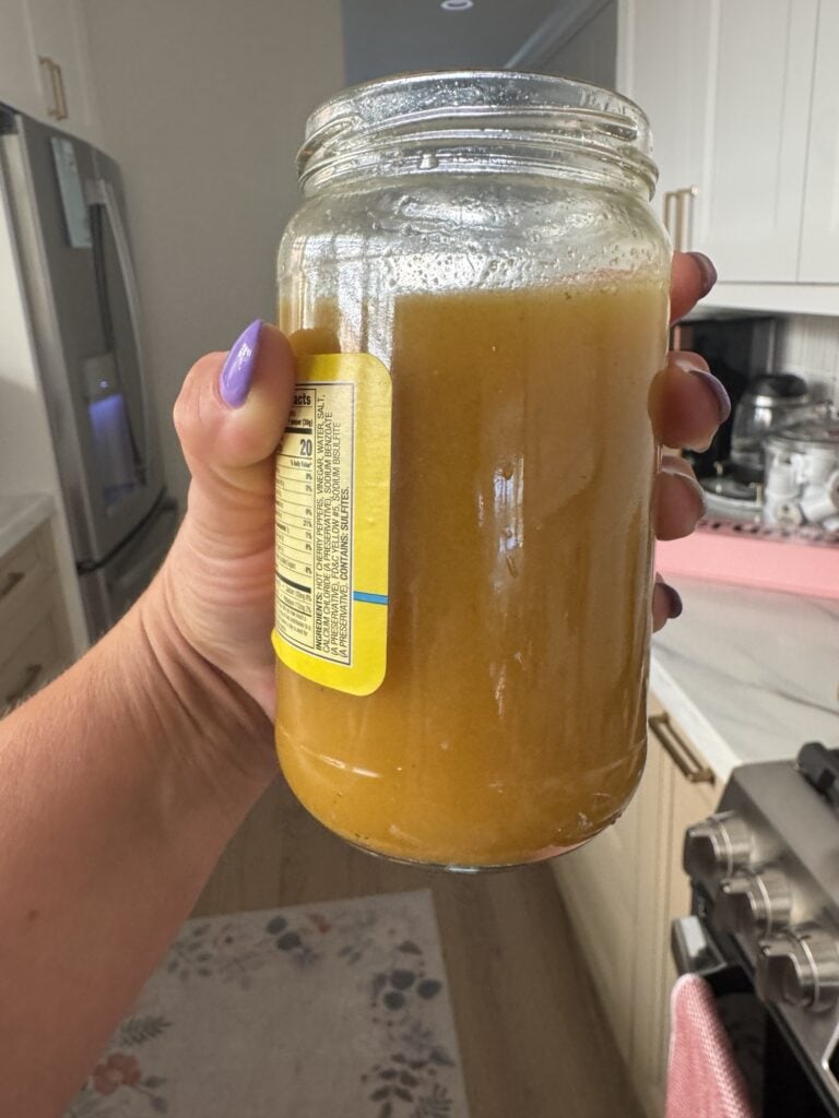 The pepper juices and broth mixed into a sauce in the pepper jar