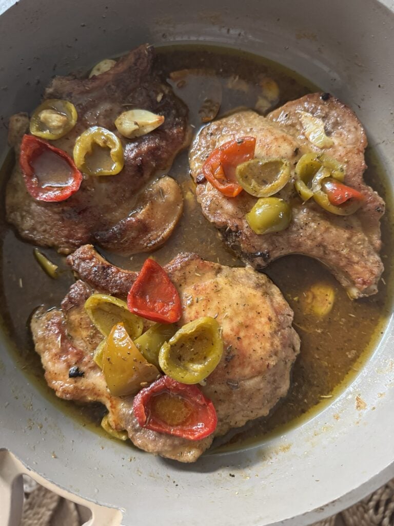 The pork chops with pepper sauce in the pan