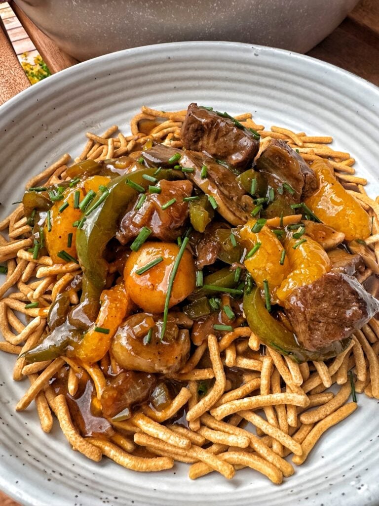 Cantonese beef and veggies over crispy noodles