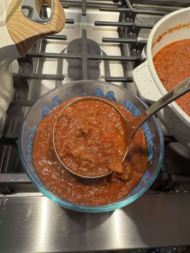 A ladle of meat sauce