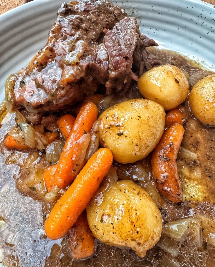 Pot roast with potatoes and carrots on a plate