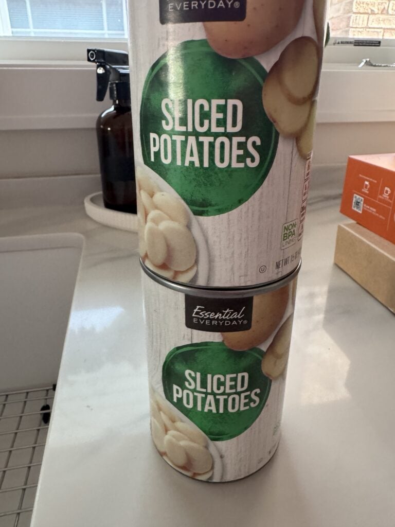 Two cans of sliced potatoes