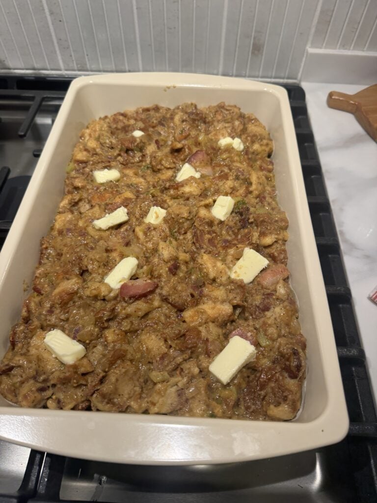 Butter on top of the stuffing in the baking dish