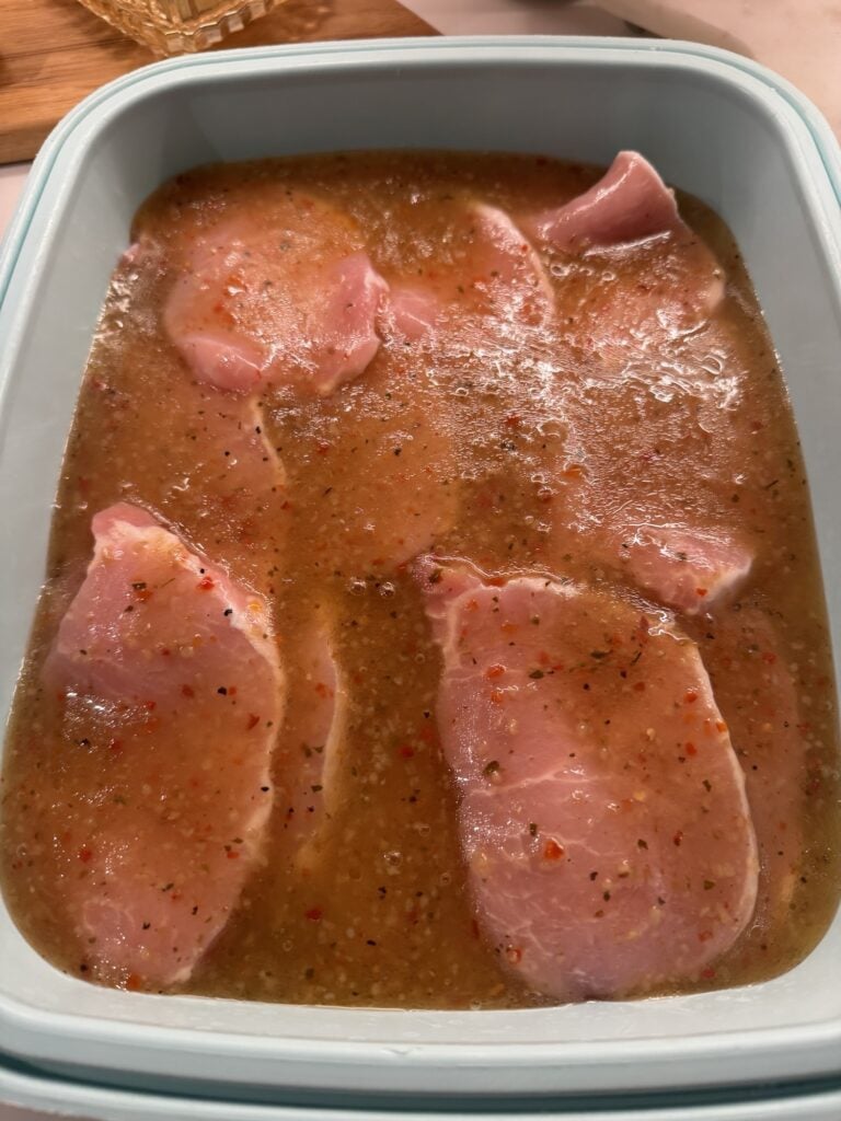 Pork chops covered in marinade