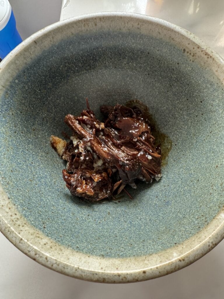 Beef with reduction in a bowl