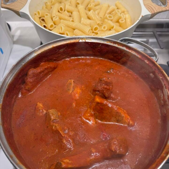 Pasta and pork chops with sauce in the pot