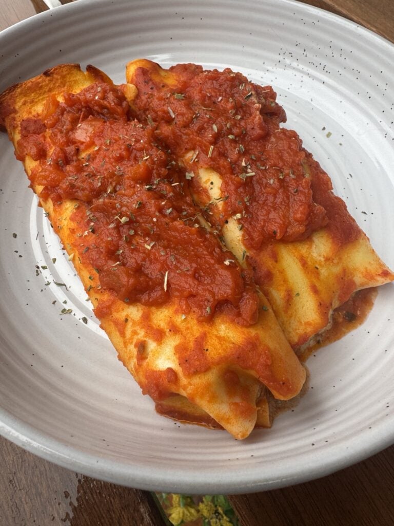 Two pieces of the finished manicotti