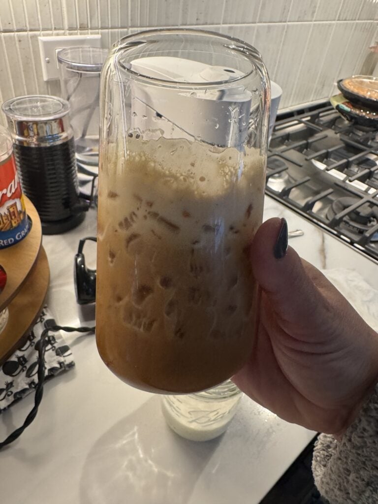 Frothy coffee in a glass