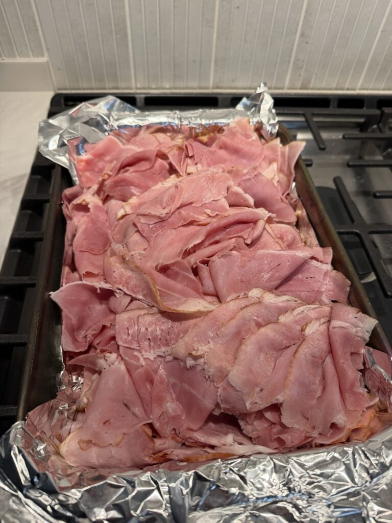 Ham slices on a baking sheet