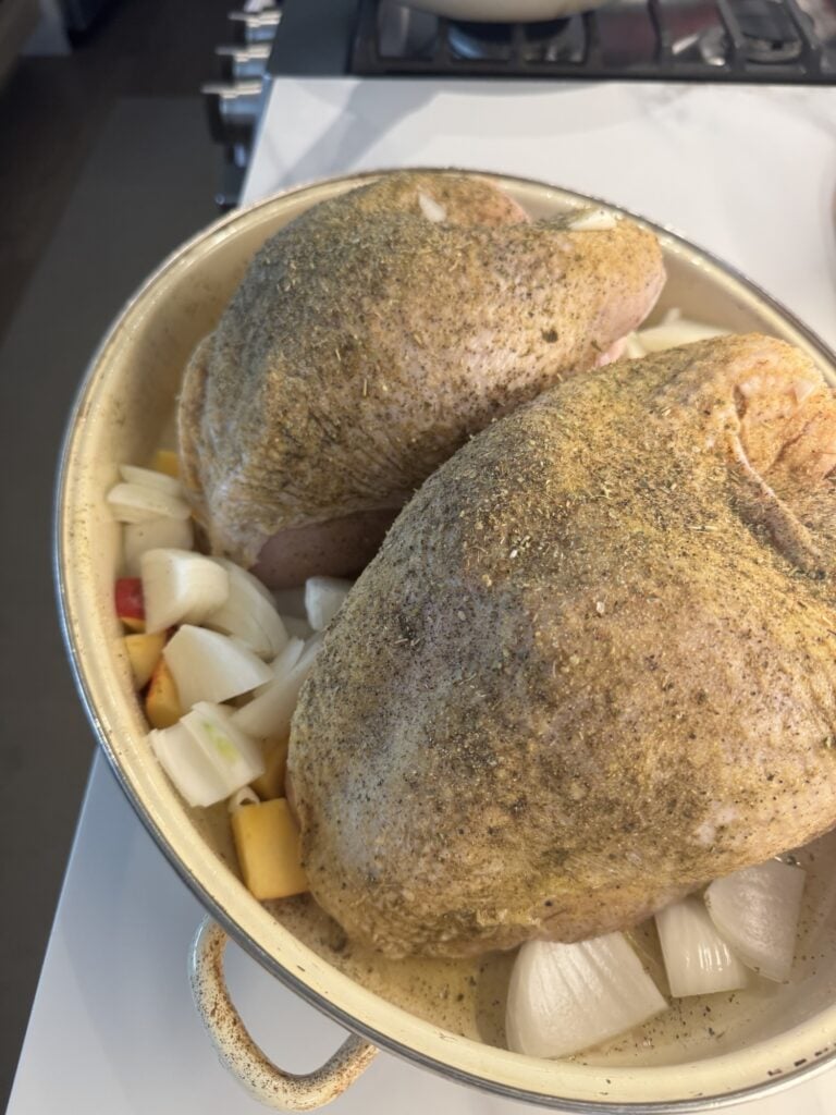 Two seasoned, raw turkey breasts
