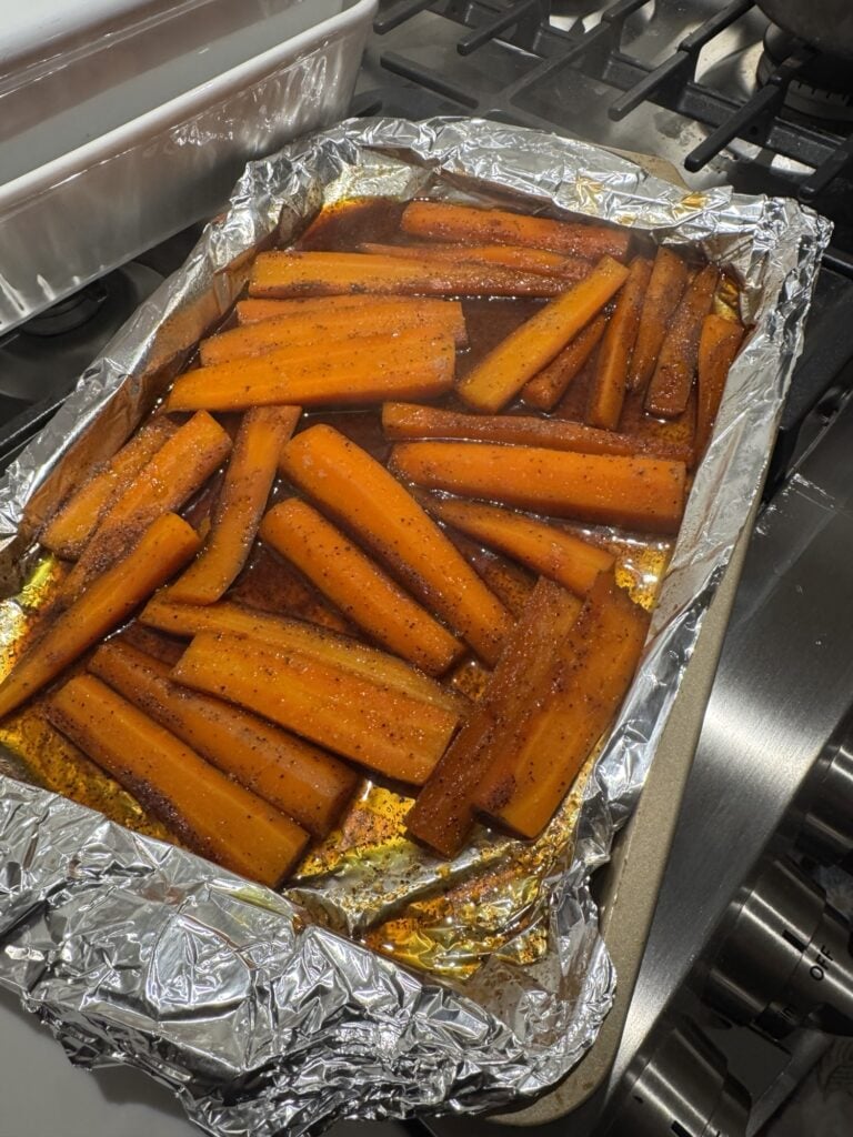 The roasted carrots on a baking pan