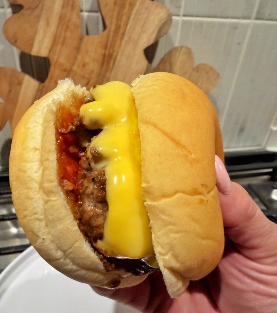 A close up of a finished burger