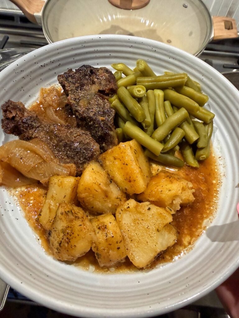 Boneless beef ribs with potatoes and green beans on the side