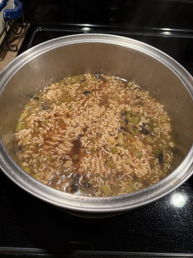 A big pot of the pork ramen soup